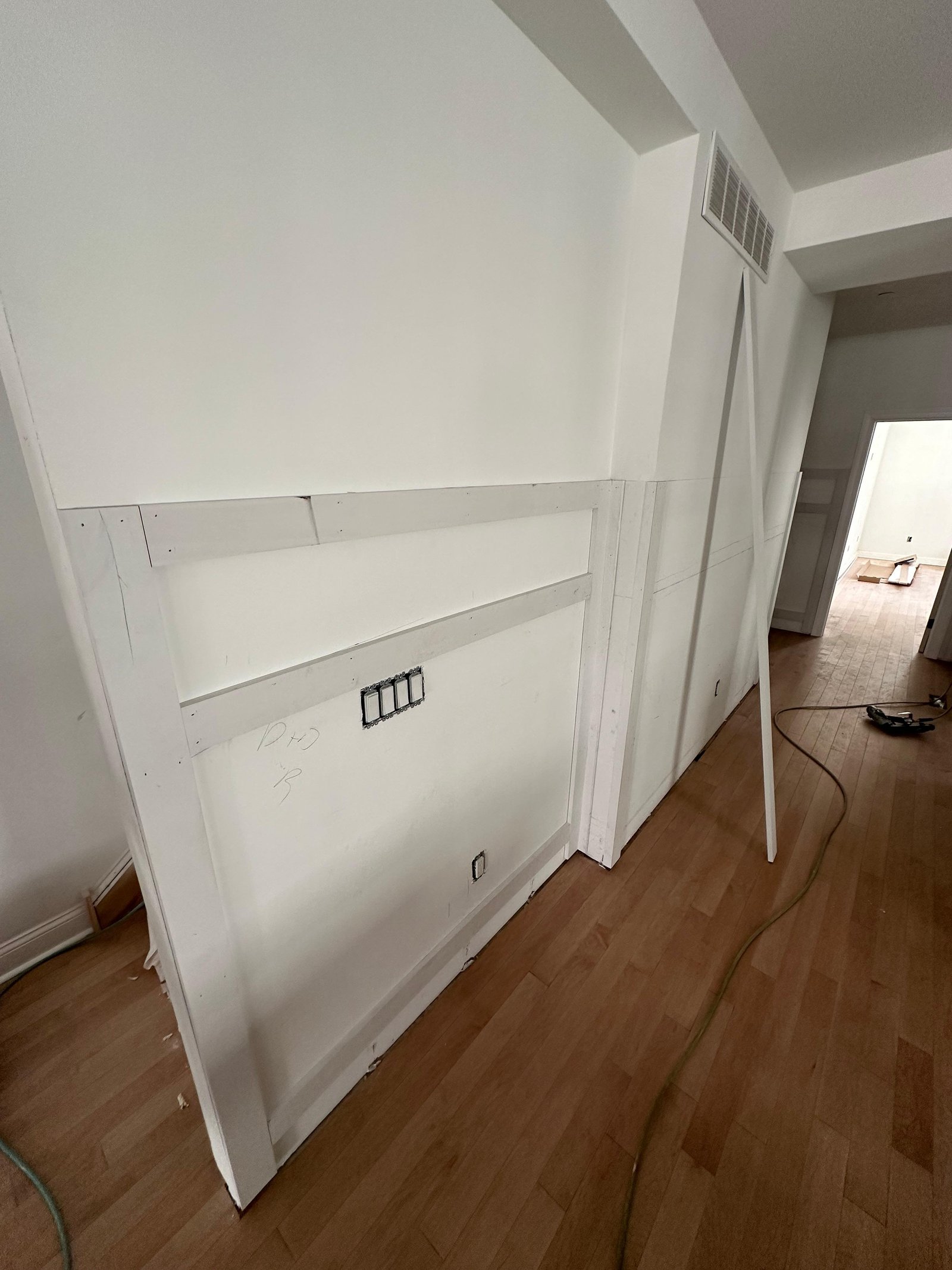Hallway wall paneling during installation